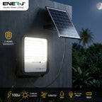 Solar light fixture with battery and panel on a wall, featuring Ener-J branding.