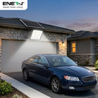 Blue car parked in front of a house with solar panels on the roof, featuring Ener-J branding.