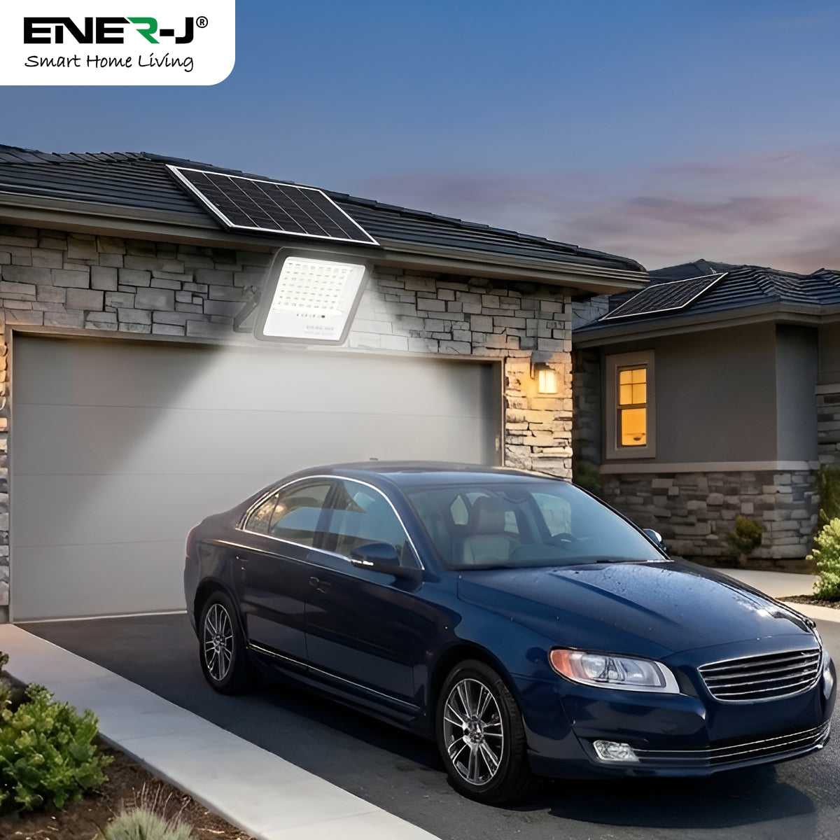 Blue car parked in front of a house with solar panels on the roof, featuring Ener-J branding.