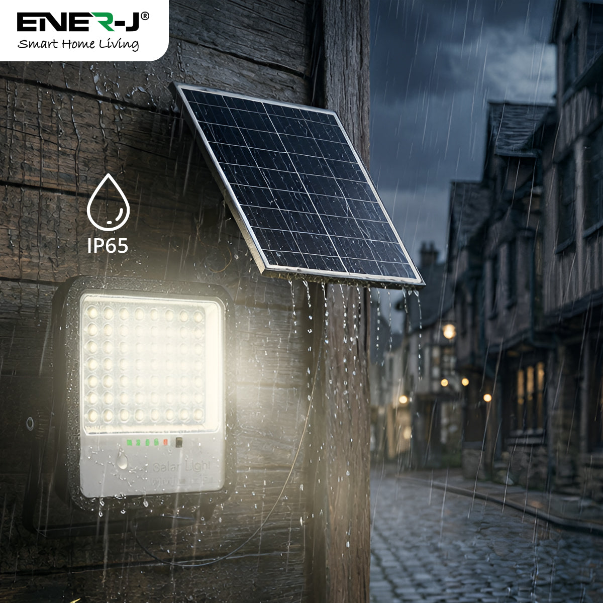 Solar light fixture on a building exterior with a dark sky and cobblestone street.