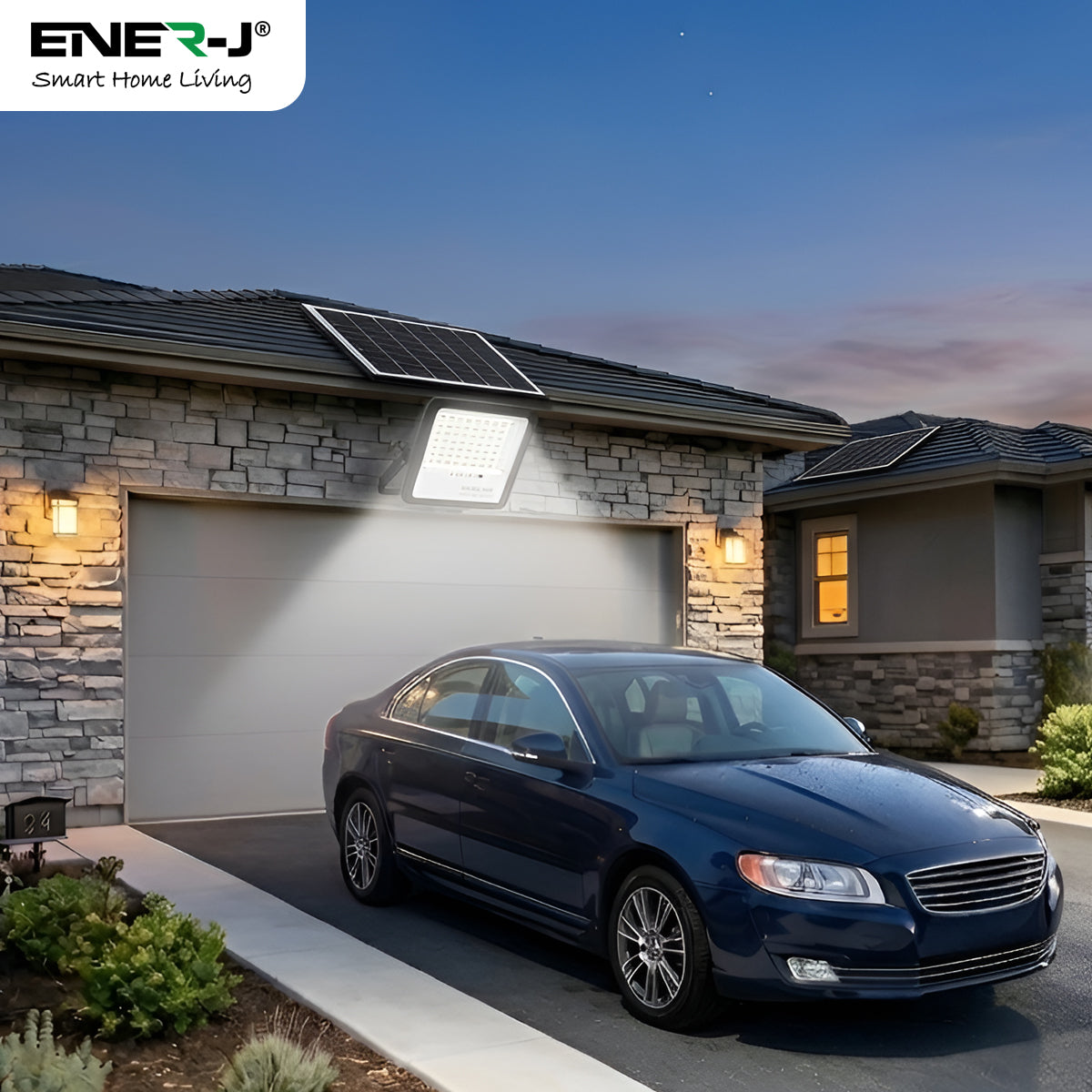 ENER-J solar LED floodlight illuminating house garage and driveway at night