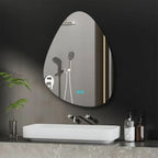 A teardrop-shaped wall mirror with an integrated LED light strip and touch controls, mounted on a dark gray bathroom wall above a white vessel sink.
