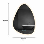 An irregularly shaped black LED-backlit bathroom mirror with dimension markings showing 800mm height and 600mm width, reflecting a modern black bathtub in a dark bathroom.